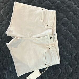 Brand new white Carve cut off shorts